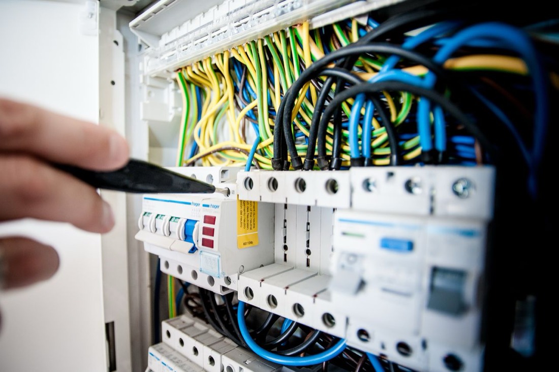 Electrician working on an electrical panel