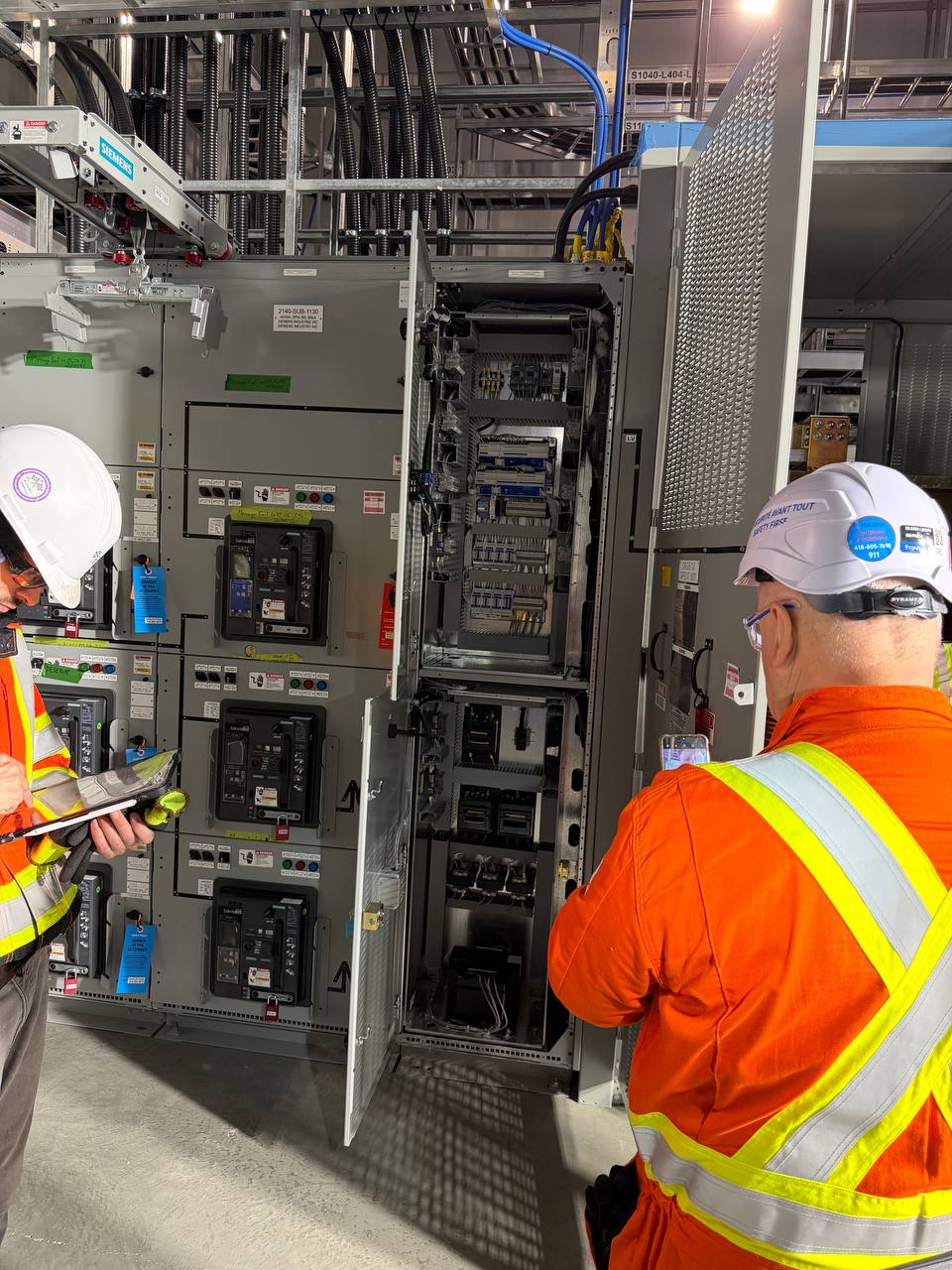 Provolta electricians inspecting switchgear